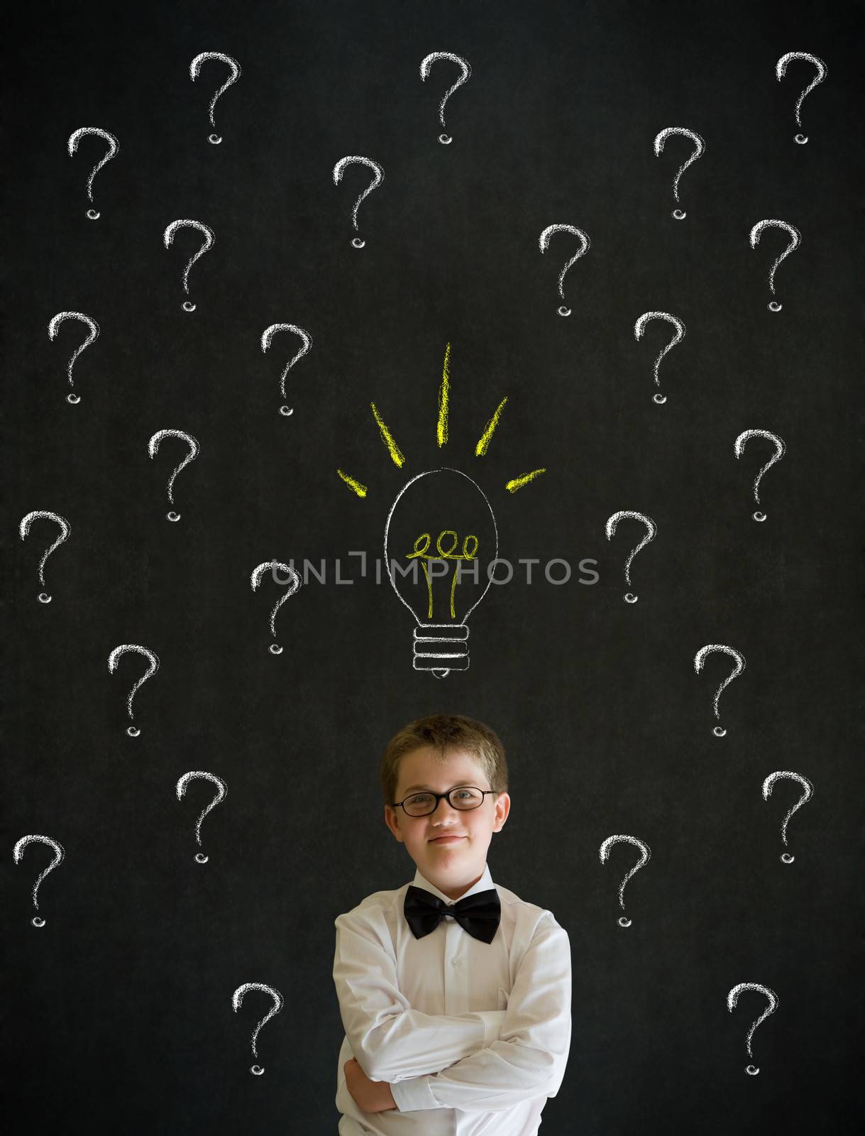 Thinking boy dressed up as business man questioning ideas by alistaircotton