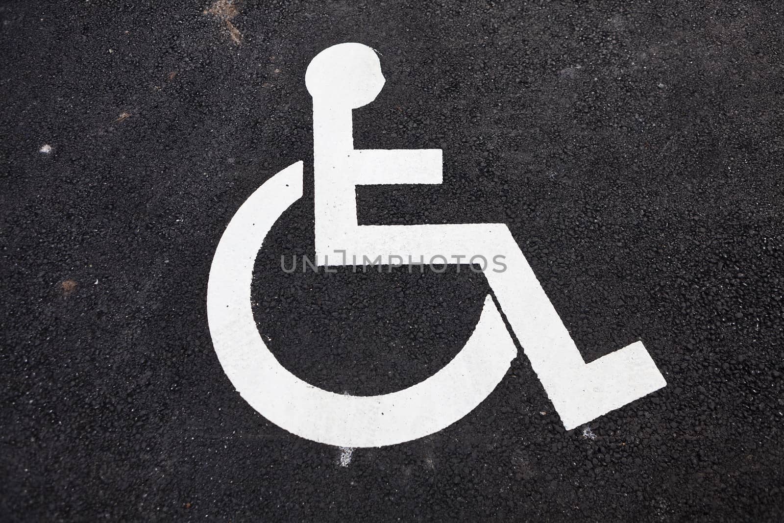 Disabled Sign on asphalt background
