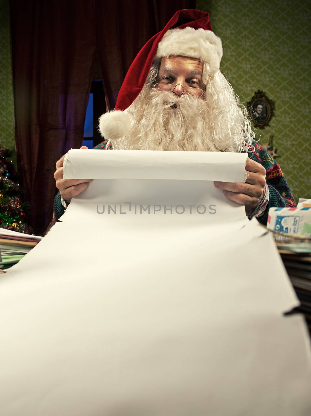 Santa Claus checking his Christmas list