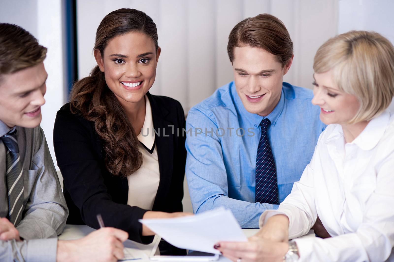 Business team discussing ideas by stockyimages