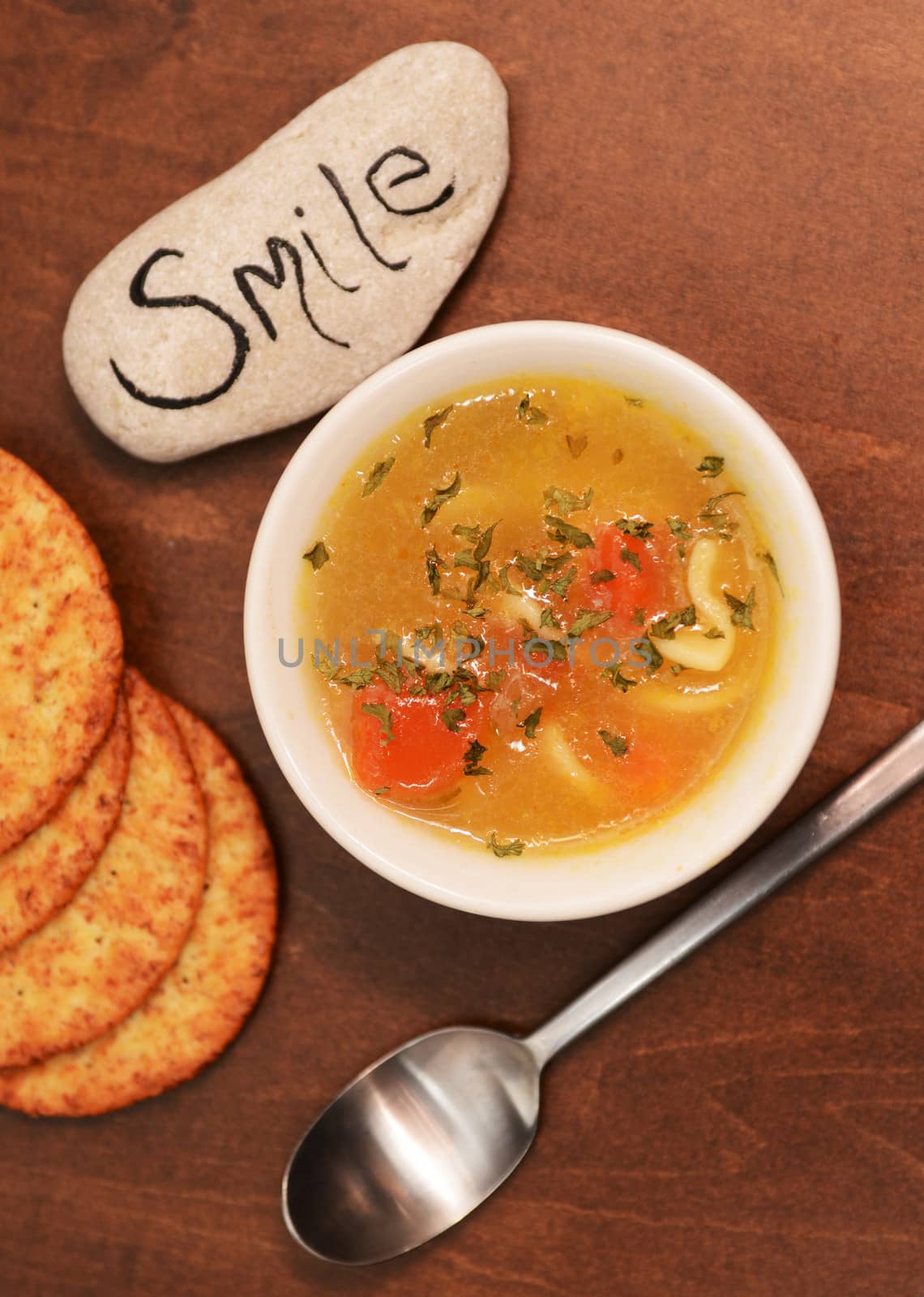 smile and bowl of soup with crackers