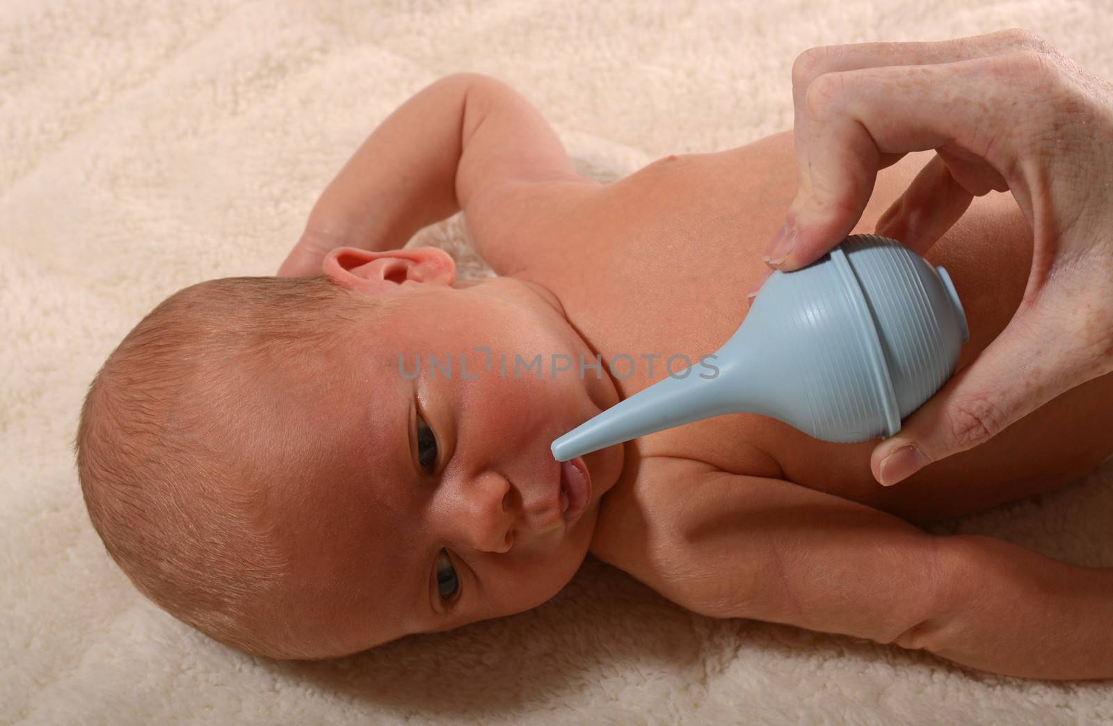 sick baby and nasal aspirator