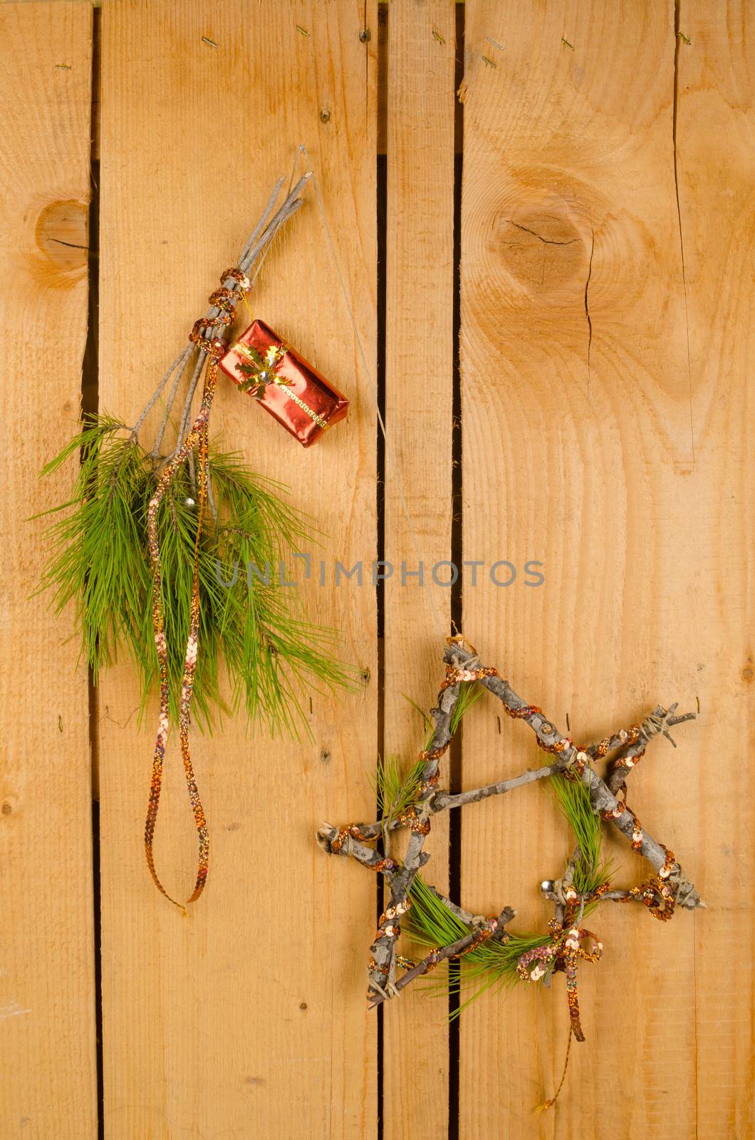 Homemade Christmas ornaments pinned on a wooden door