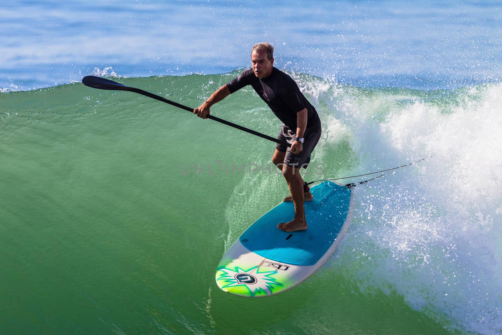 Surfing Rider SUP Wave by ChrisVanLennepPhoto