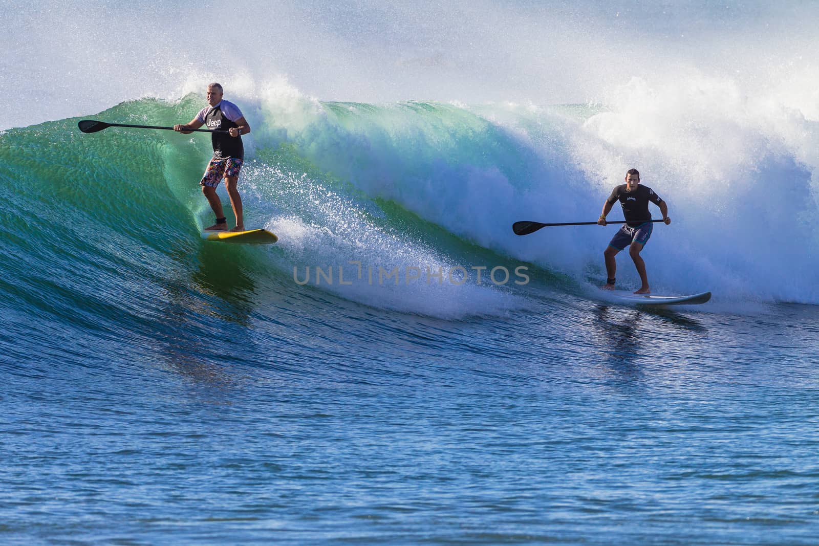 SUP Riders Surfing Wave by ChrisVanLennepPhoto