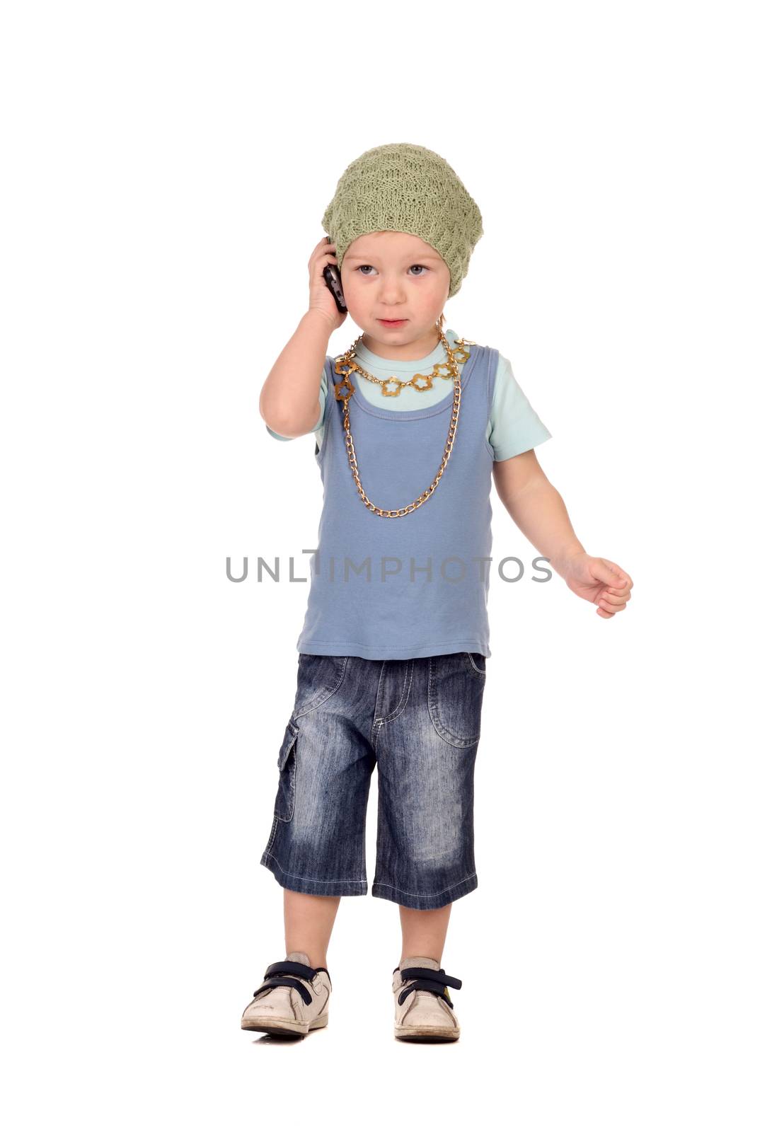 Little boy talking by the phone isolated on the white