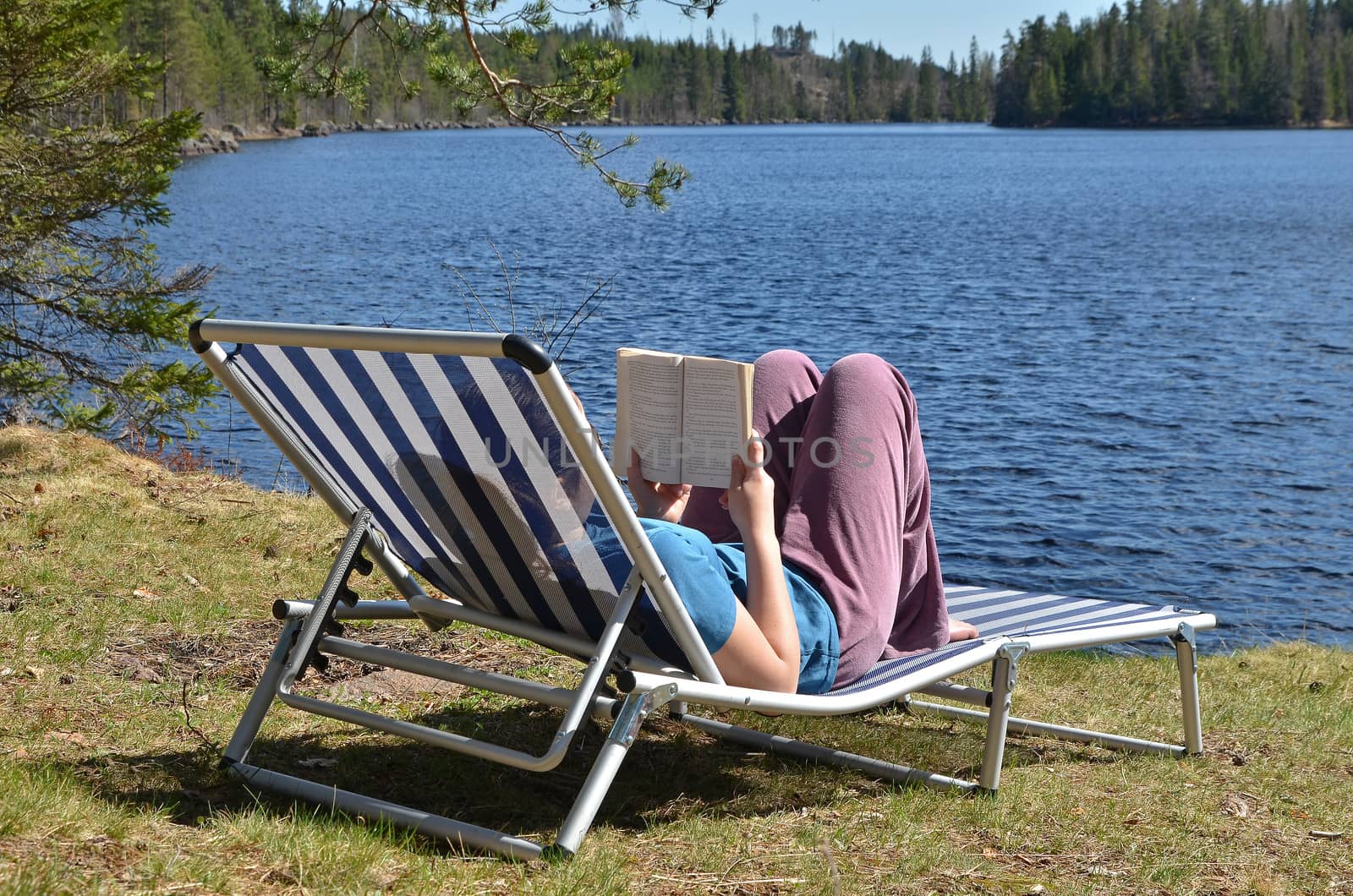 Reading book by the lake by anlu