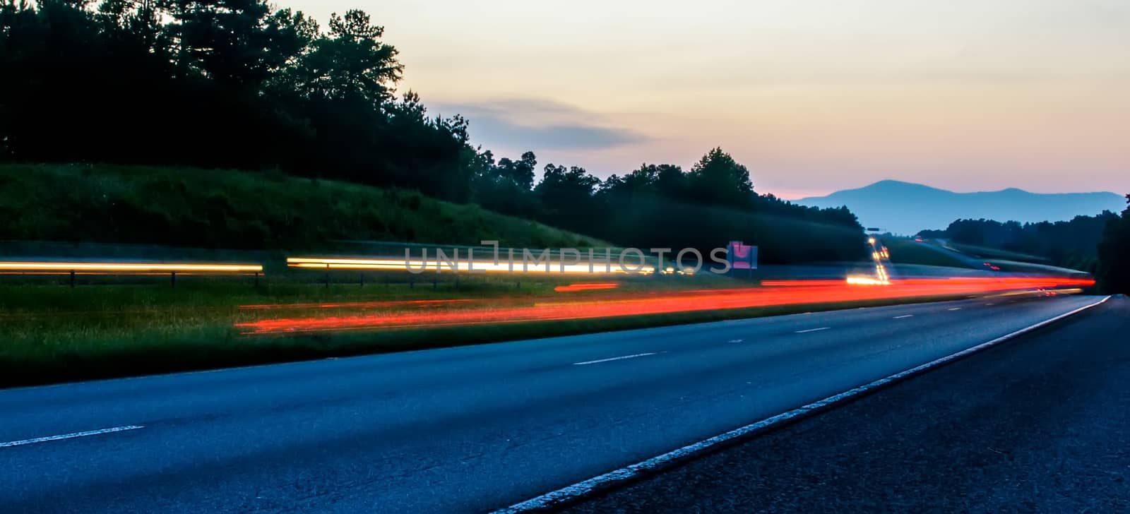 Night road against the sunset sky in the north carolina blue ridge mountains