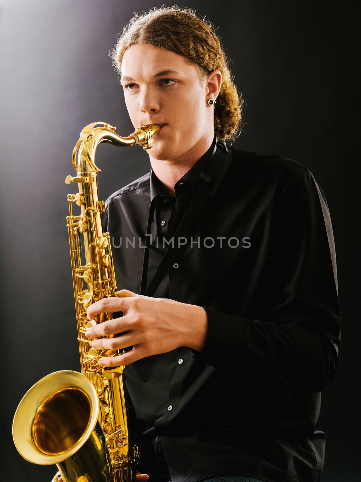 Young saxophone player by sumners