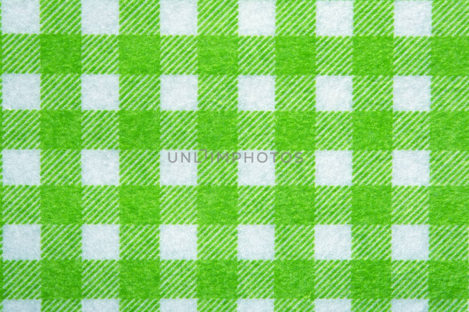 Material into green grid, textile background