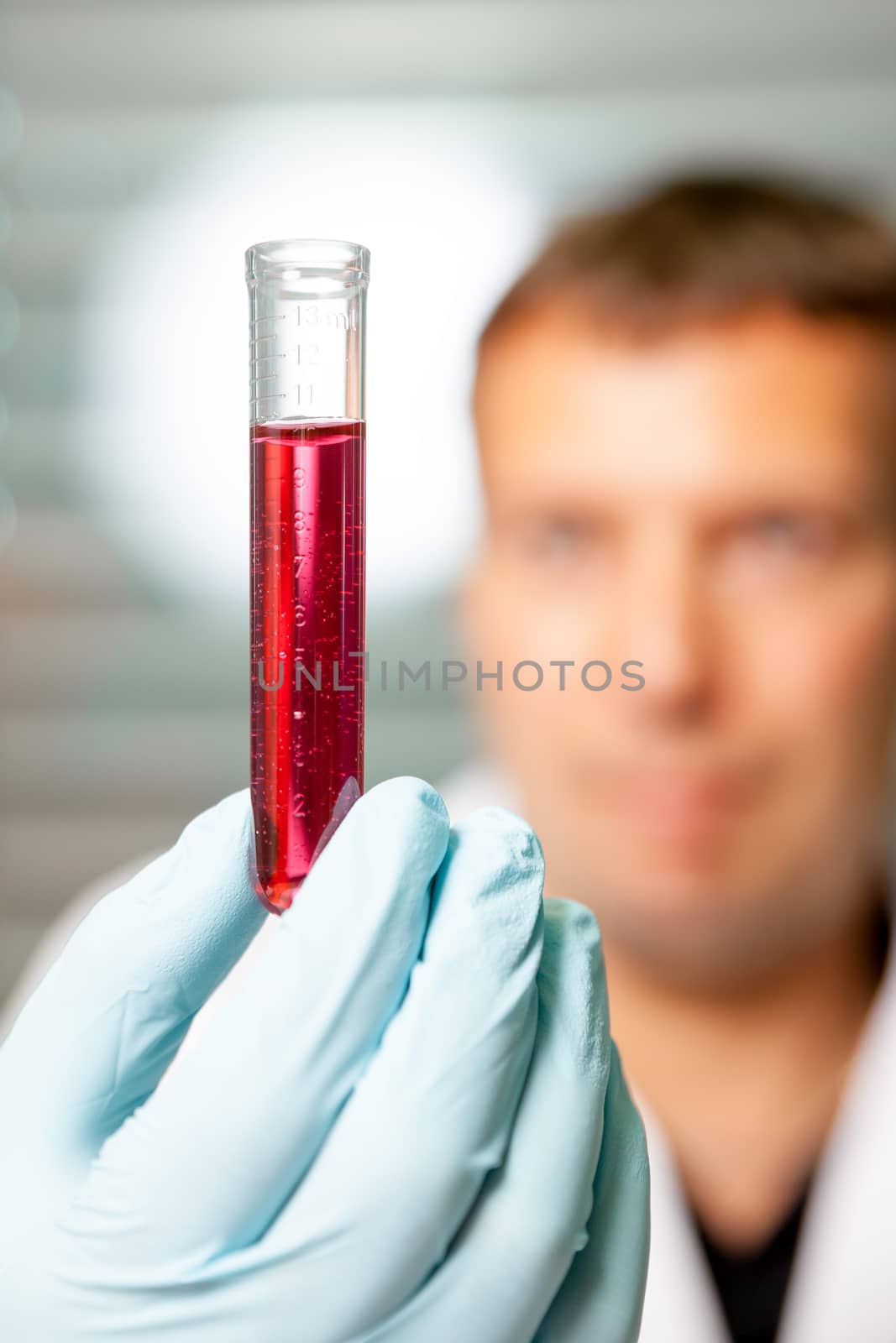 An image of test tube with a red fluid