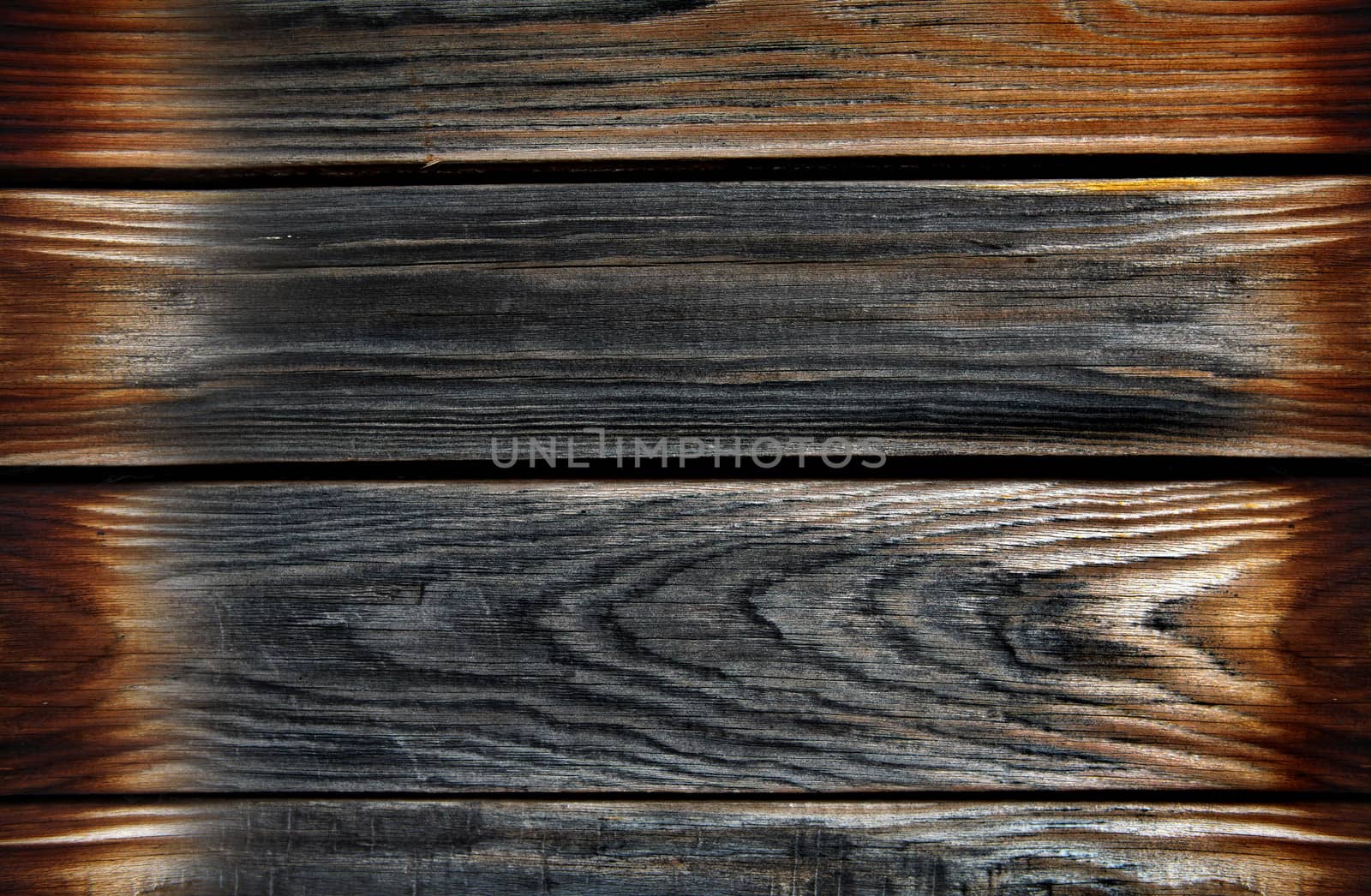 Vintage wooden planks with burned edges