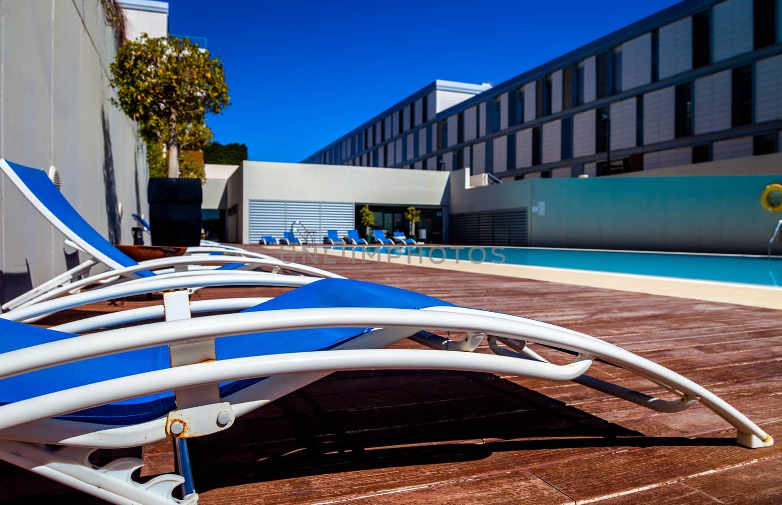 Several deckchairs near the swimming pool
