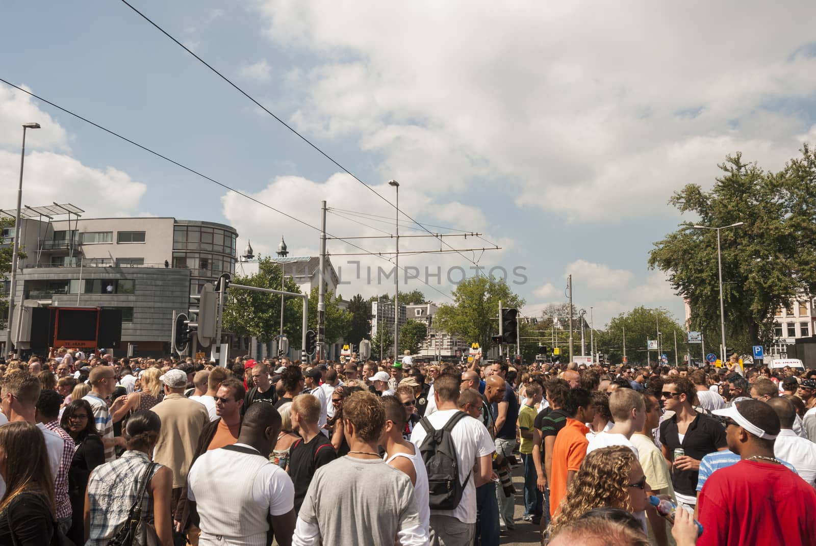 crowd people on the street during dance event in the summer