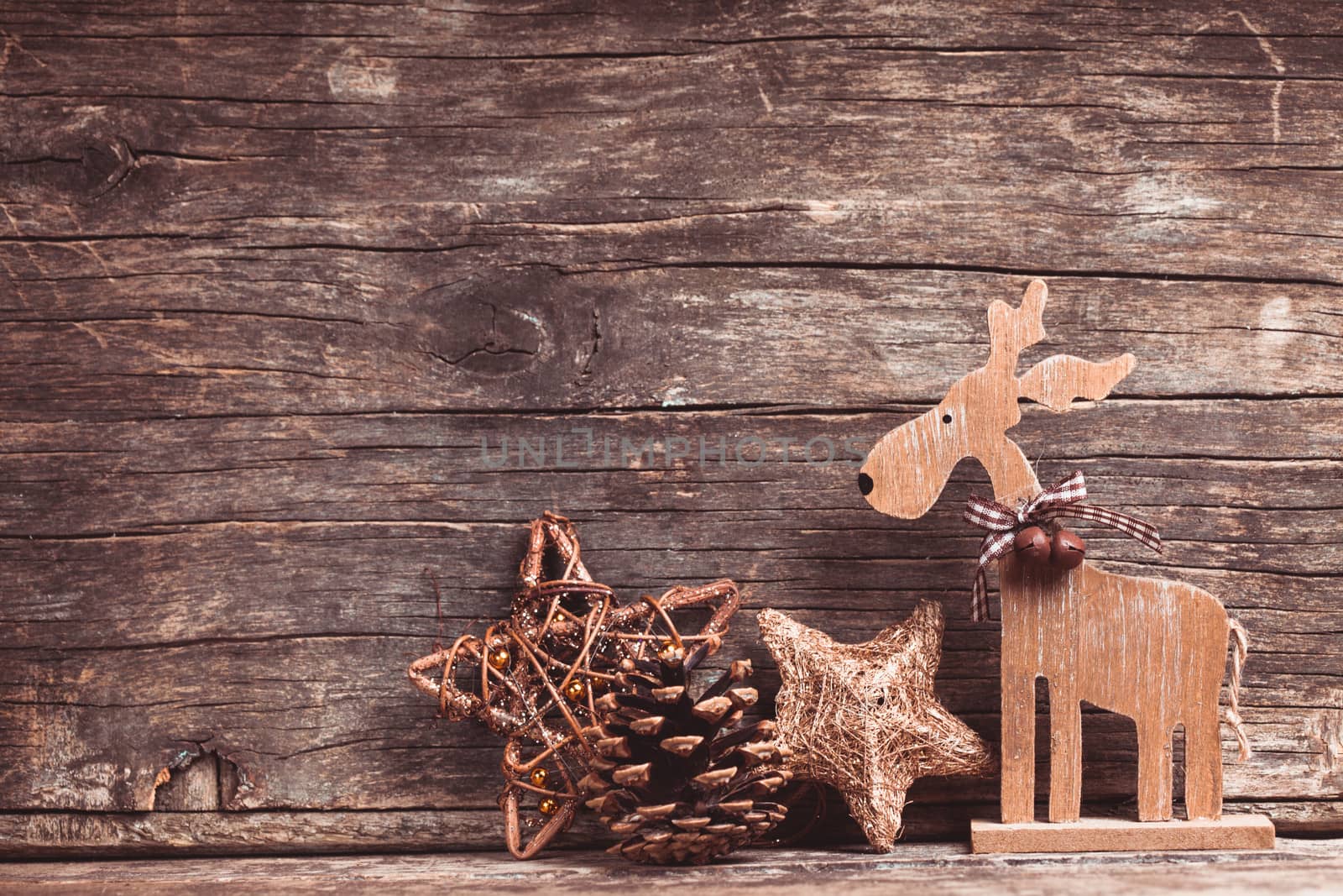 Natural christmas decor - deer over wooden background
