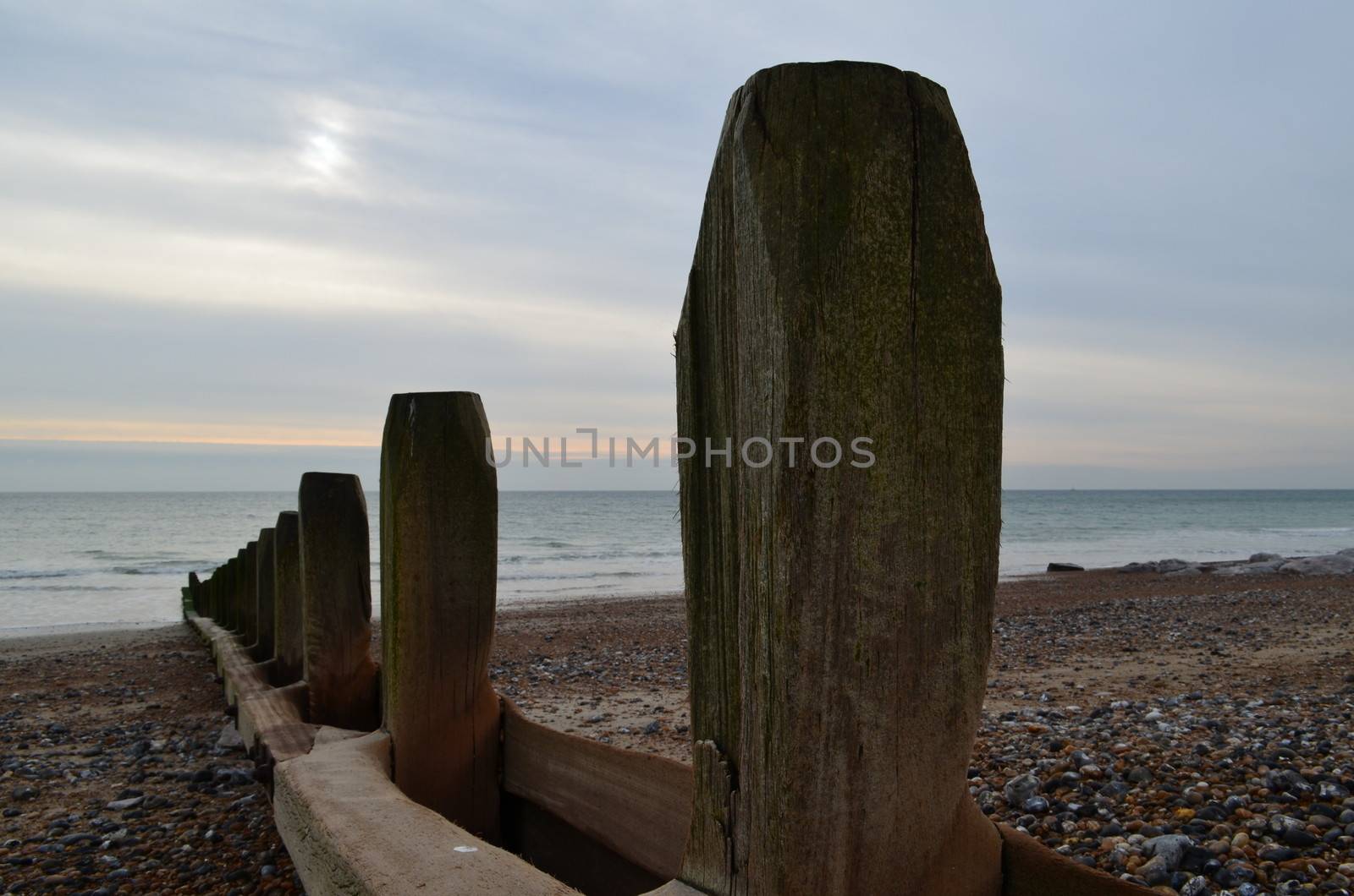 Wooden breakwater sea defence along a beach in South East coast of England.Image taken in November 2013.