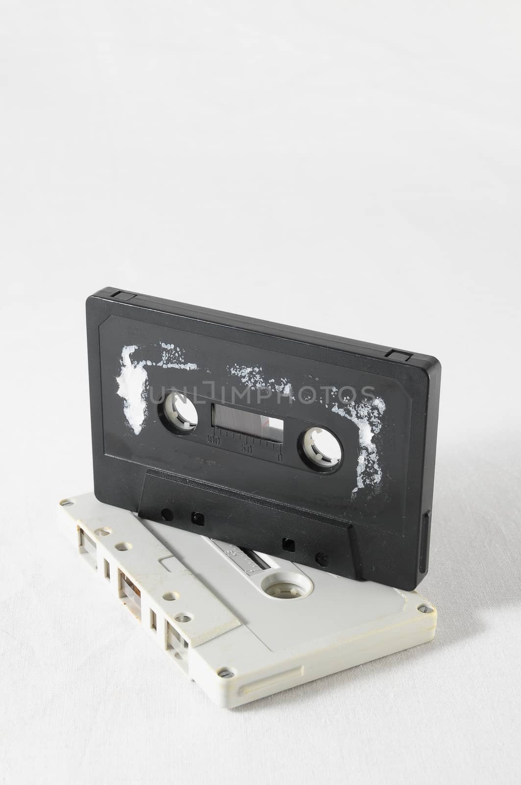 Ancient Vintage Used Musicassette over a White Background