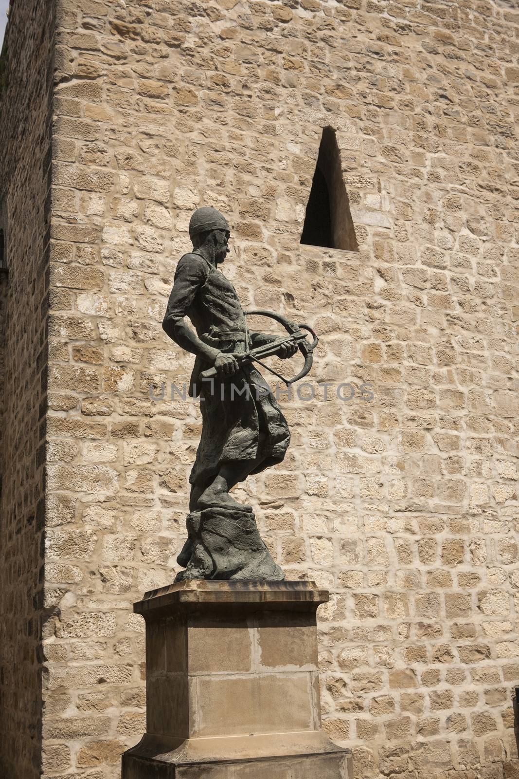 Monument tribute to the Company of the two hundred Ballesteros of Mr Santiago, represents a warrior, armed crossbow, Baeza, World Heritage city by UNESCO, Jaen province, Andalusia, Spain