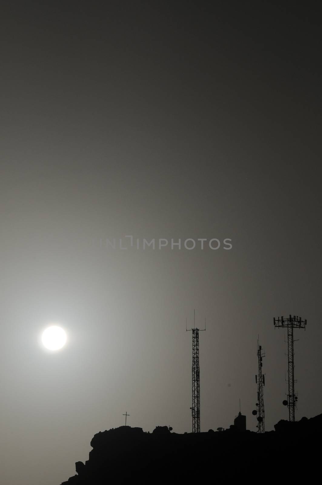 Some Silhouetted Antennas on the top of a Hill