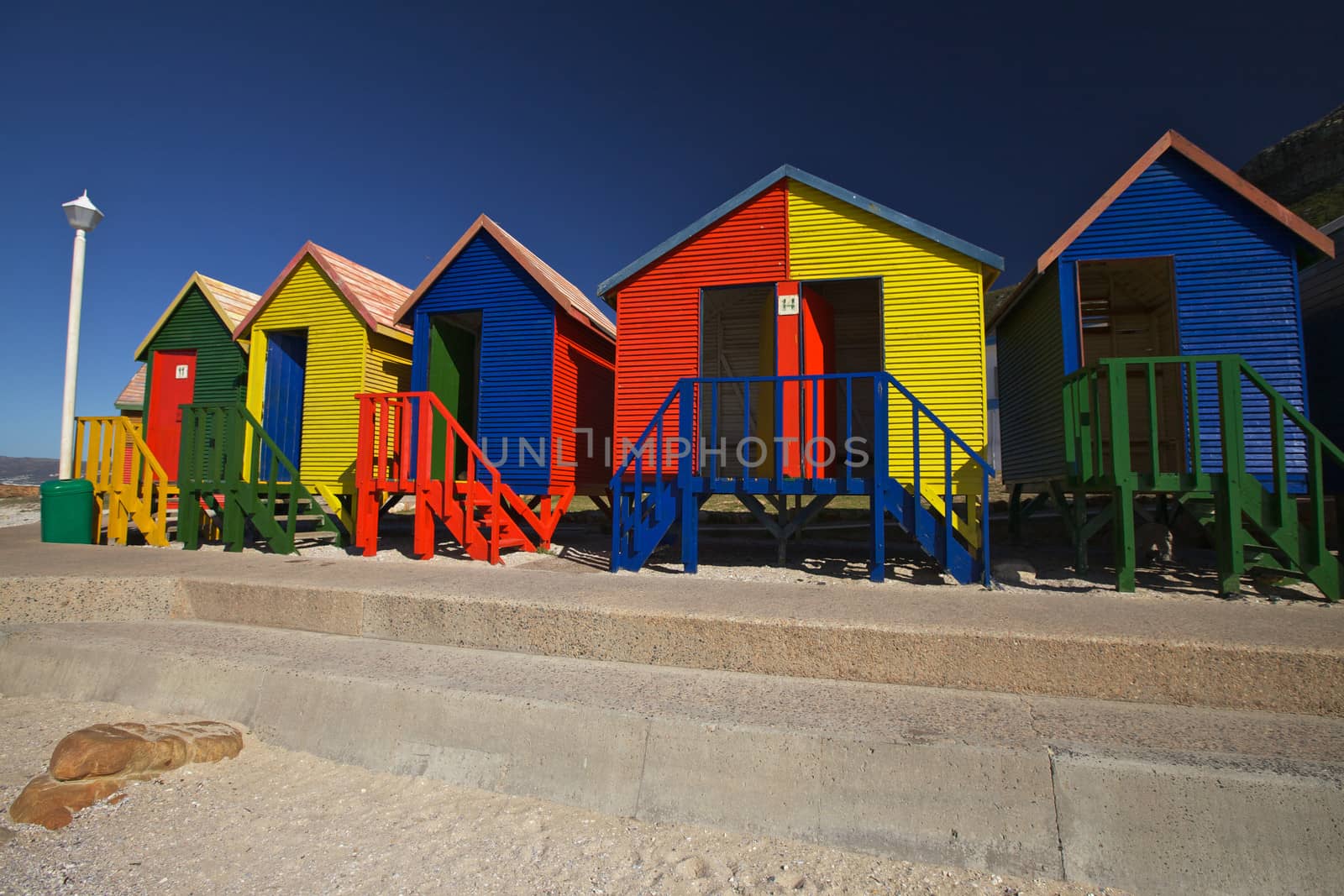 Colourful wooden changing cabins at the Beach St James Beach, Cape Town, South Africa