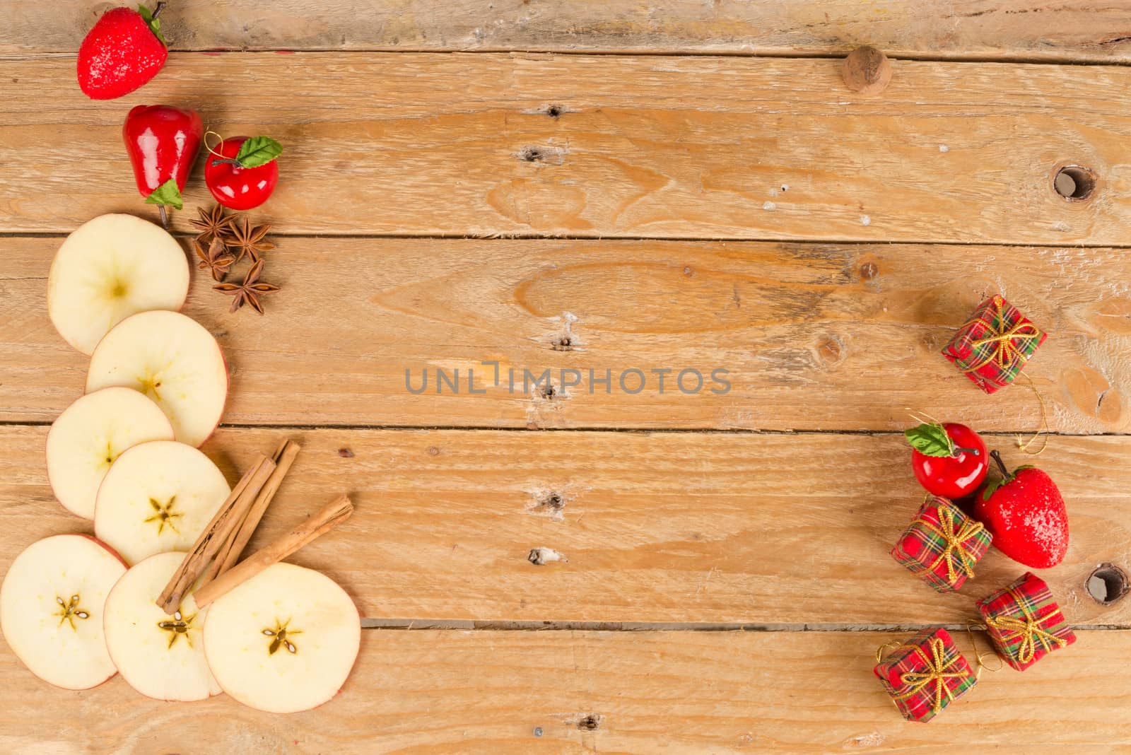 Sliced apples in a still life with cinnamon sticks