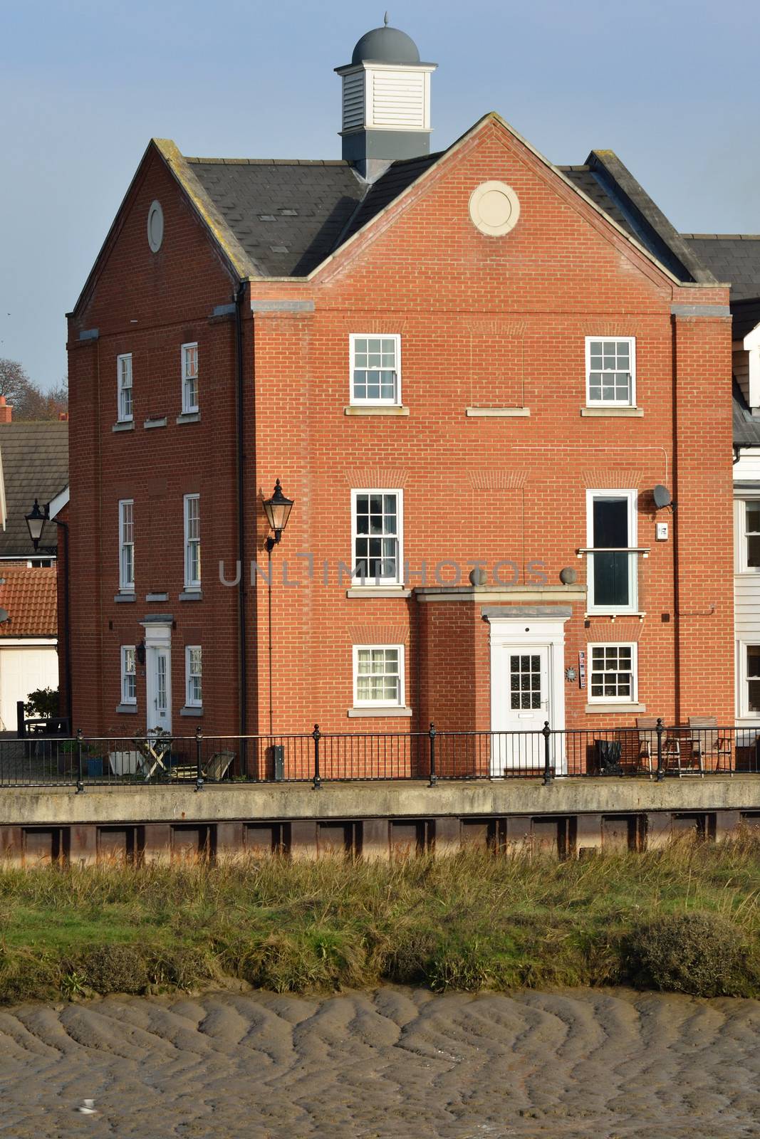 Large red brick riverside House by pauws99