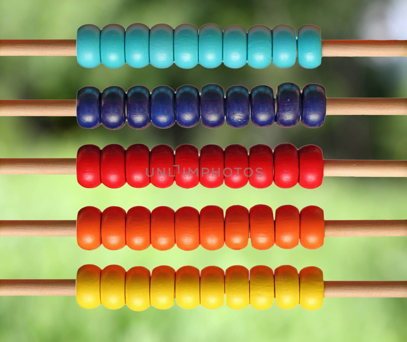 colorful wooden abacus over natural background