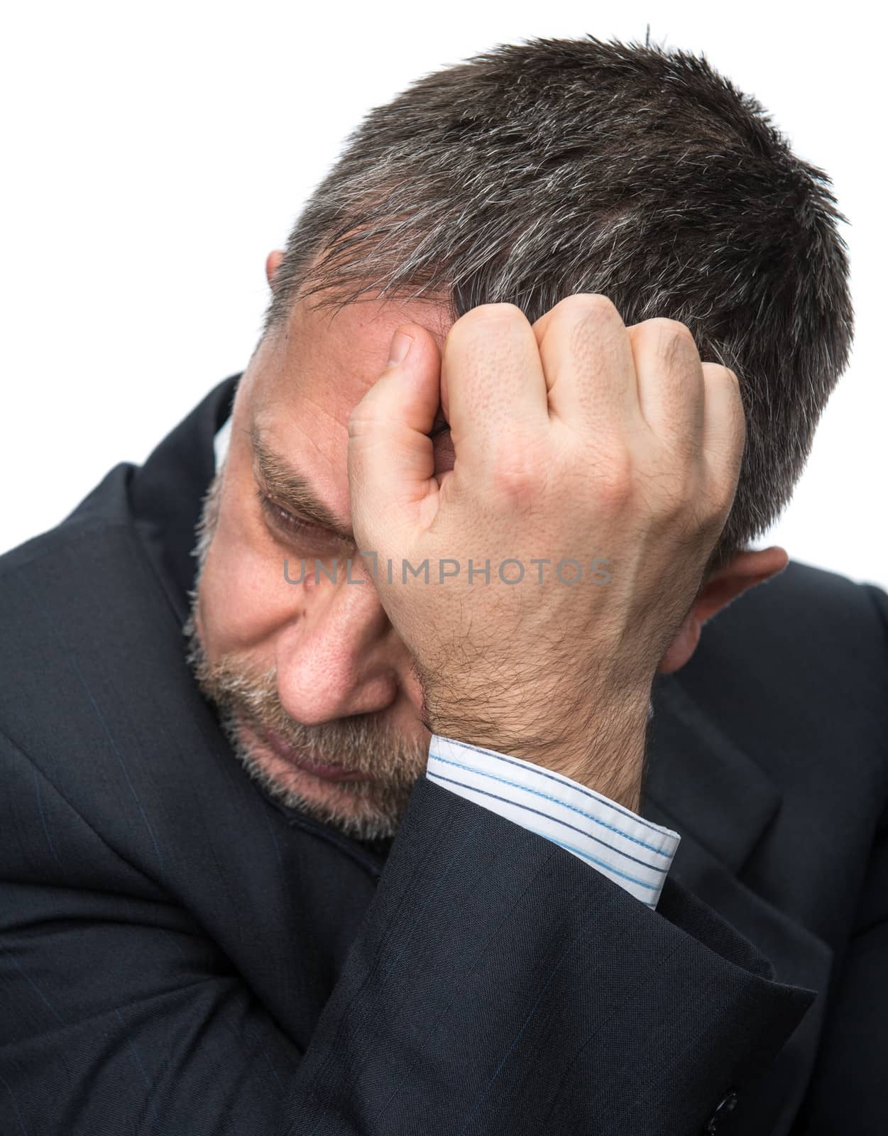 Headache. Portrait of an middle age man with face closed by hands. Isolated on white
