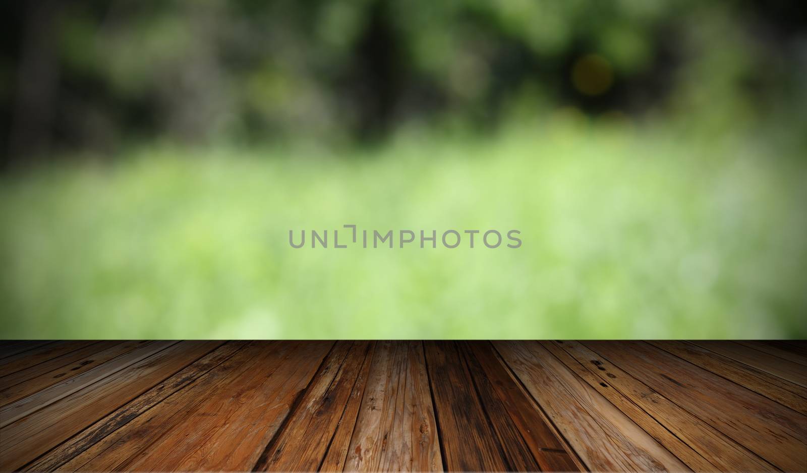 natural backdrop with wooden  terrace and out of focus green field
