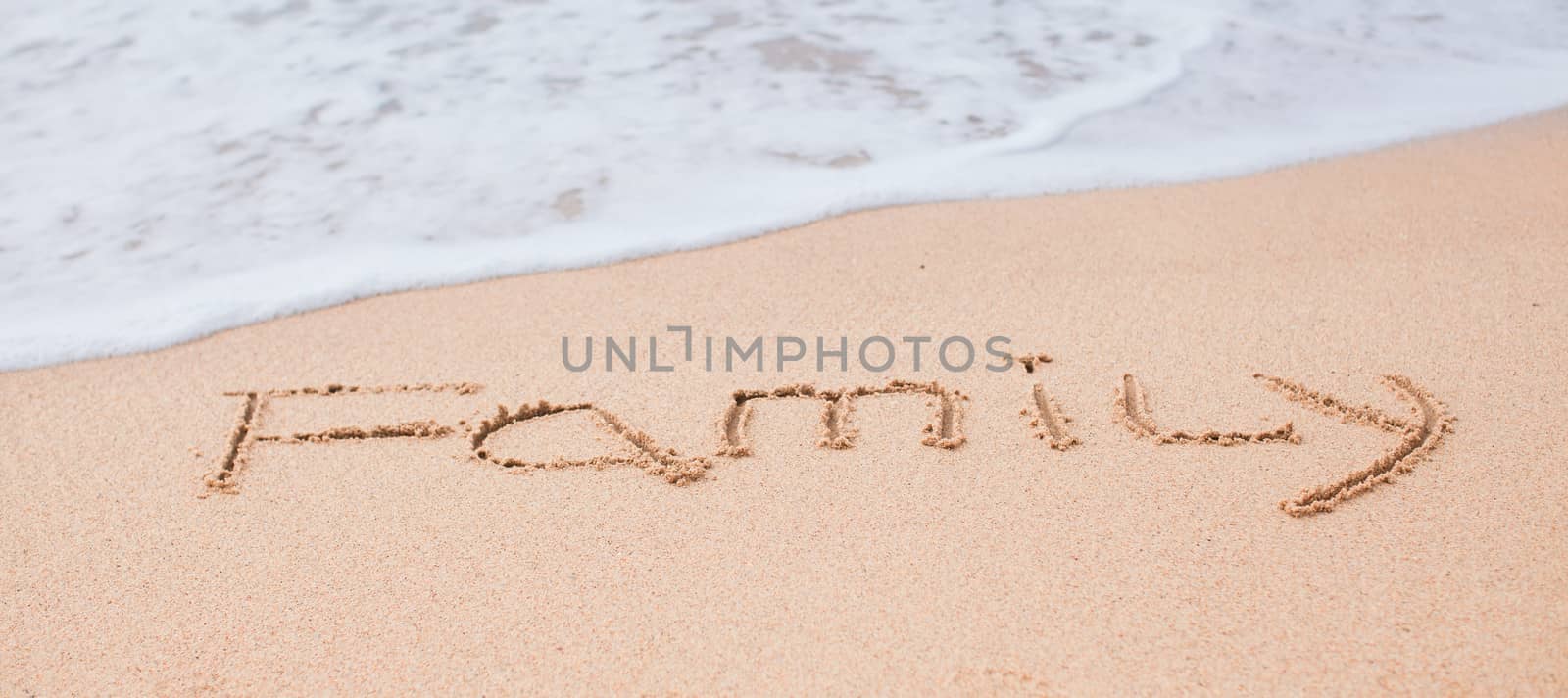 Family drawing in the sand on a tropical beach by travnikovstudio
