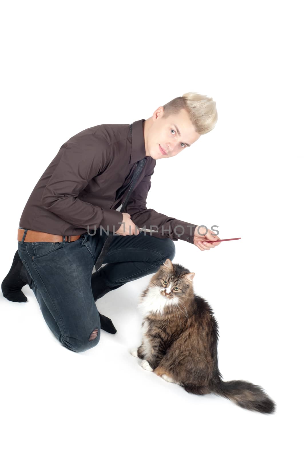 Portrait of handsome man with cat in studio isolated on white