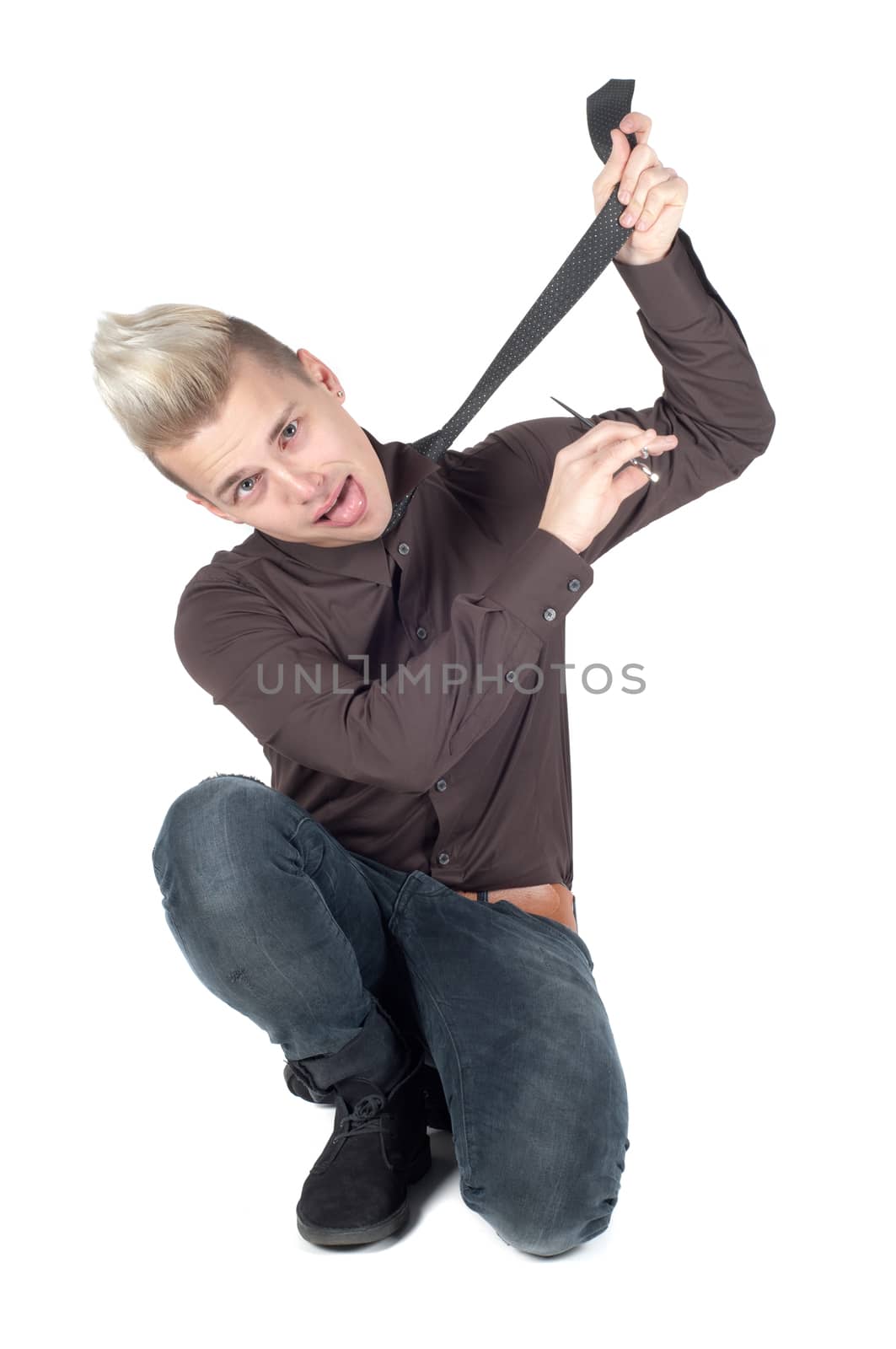 Portrait of handsome man who cuts off his tie isolated on white