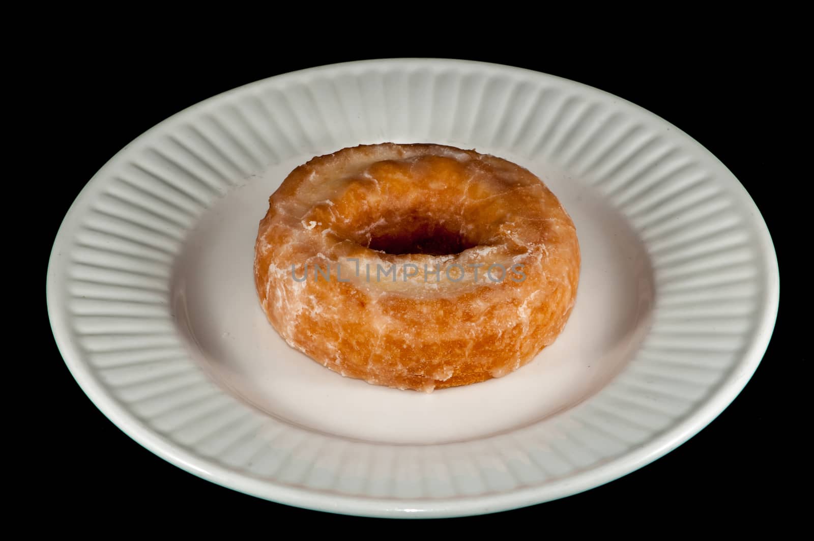 Glazed Donut Isolated on a Black Background