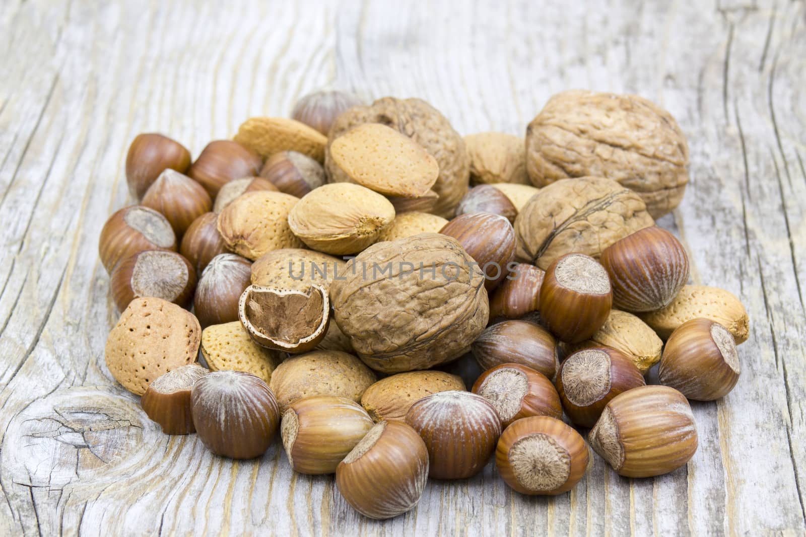 nuts on old wooden background