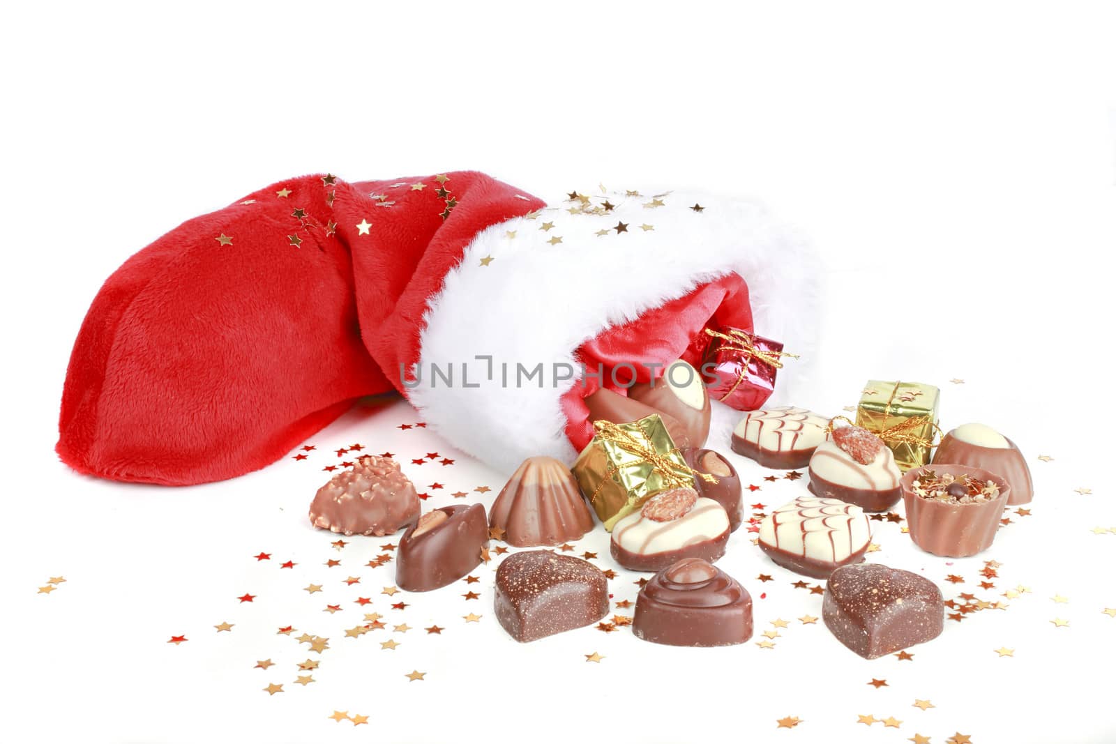 Chocolate and santa hat on a white background