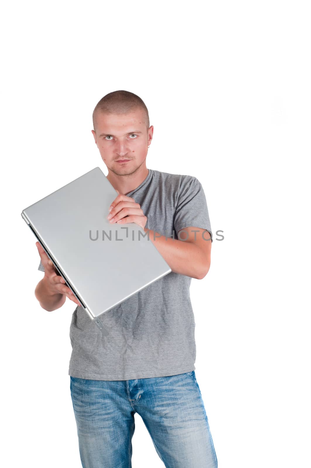 Man in casual clothing holding a laptop on his hands, isolated