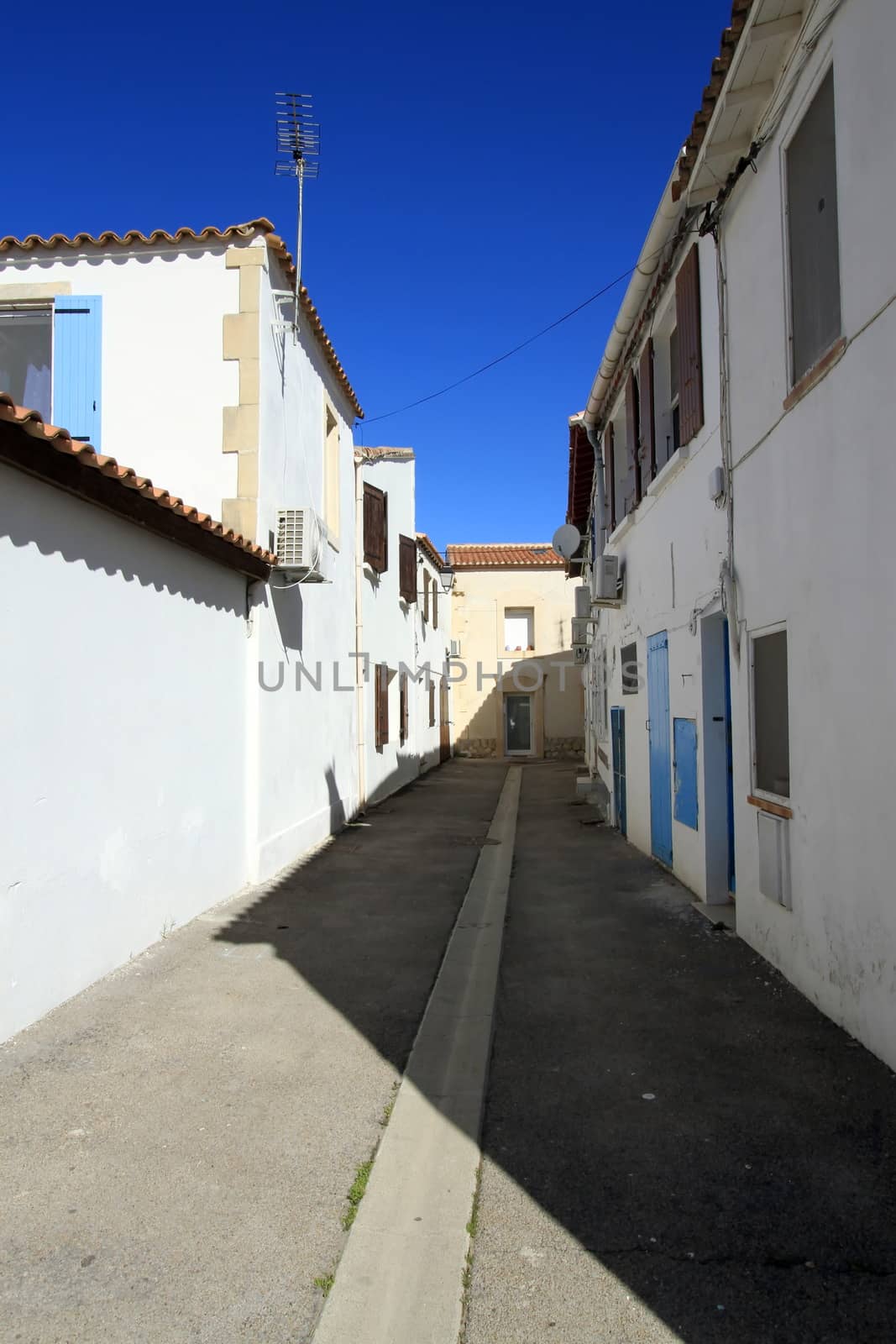 Small street at famous Saintes-Maries-de-la-mer, Camargue, France