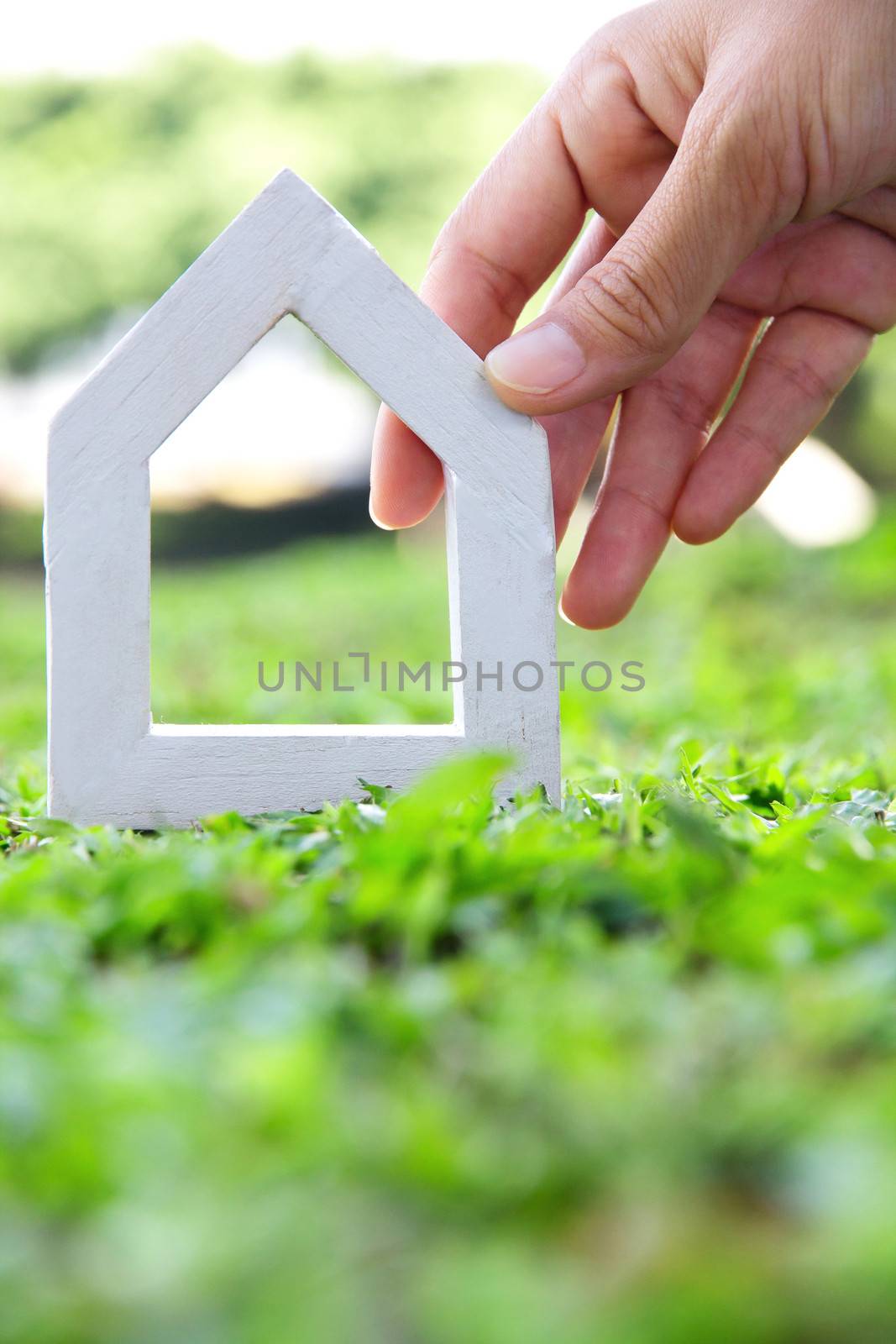 Hands holding icon house by ponsulak