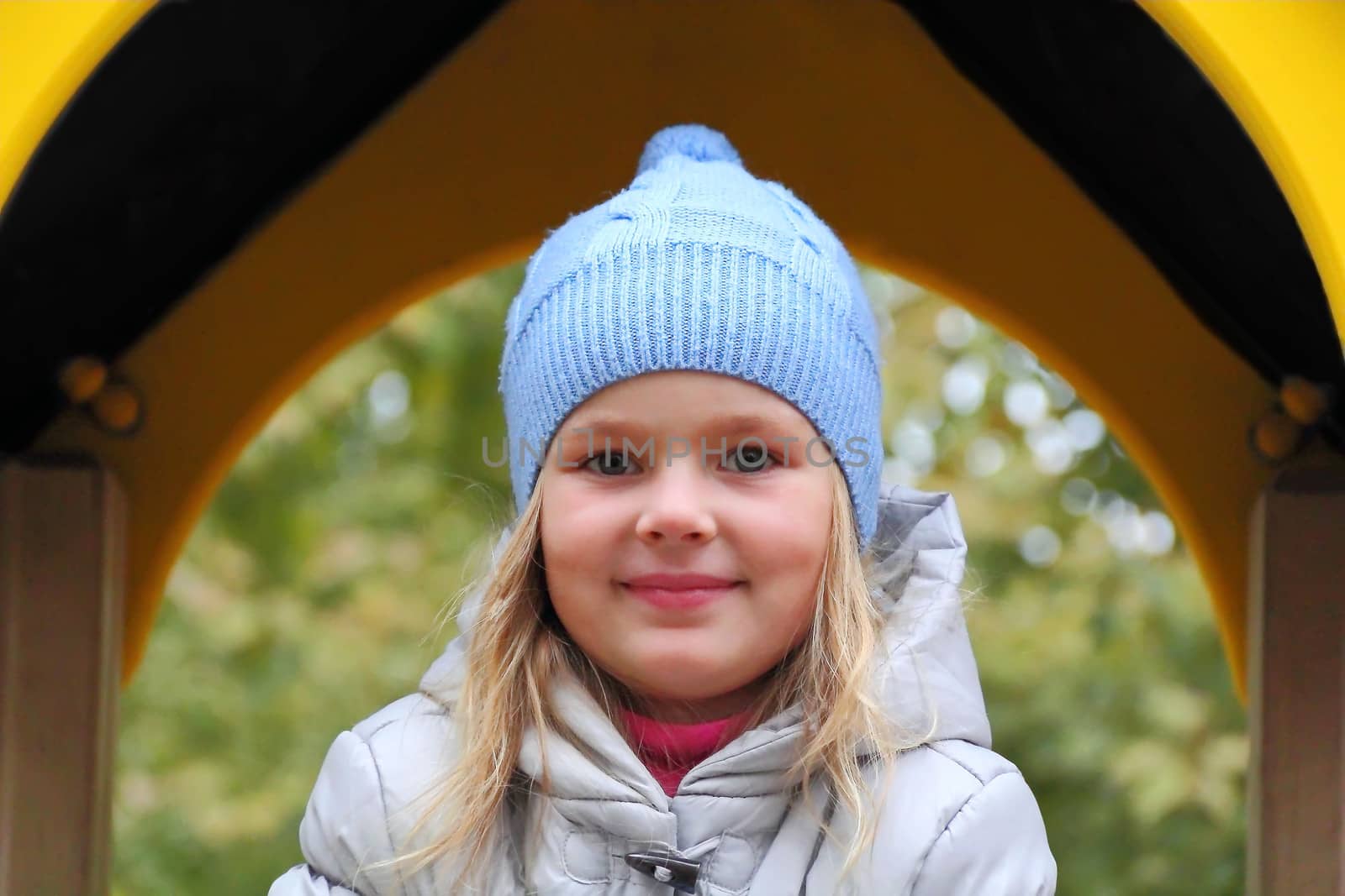 Portrait of beautiful girl with blond hair and blue eyes