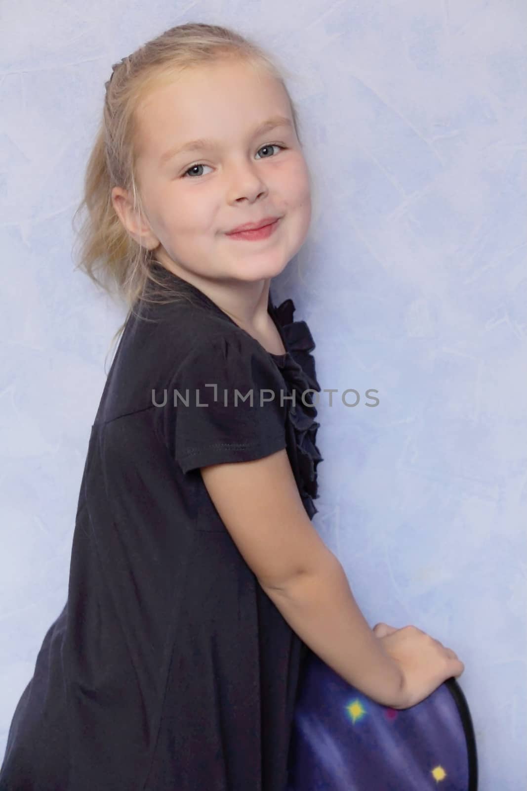 Portrait of beautiful girl with blond hair and blue eyes