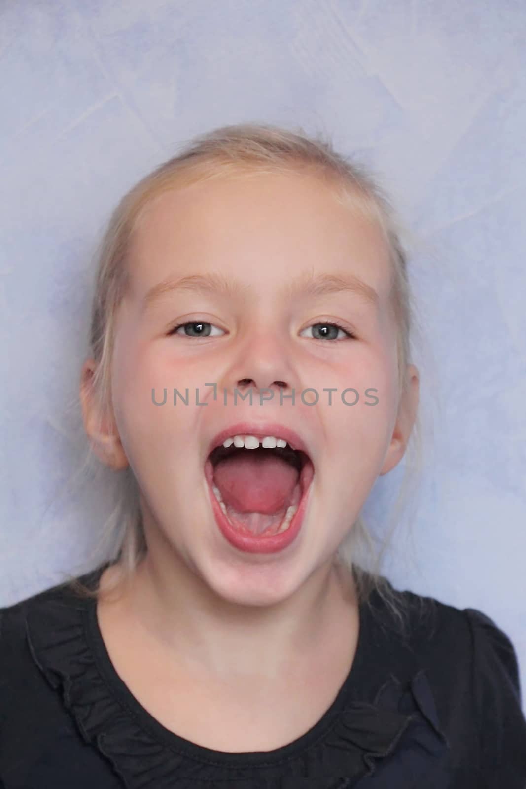 Portrait of girl with smile and open mouth