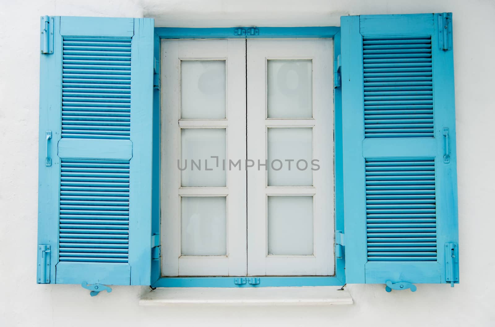 Blue wooden window on white wall6