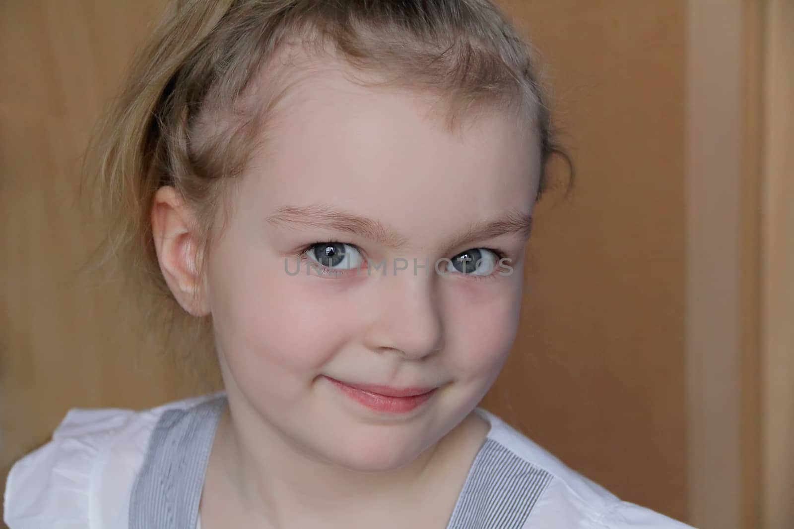 Portrait of beautiful girl with blue eyes