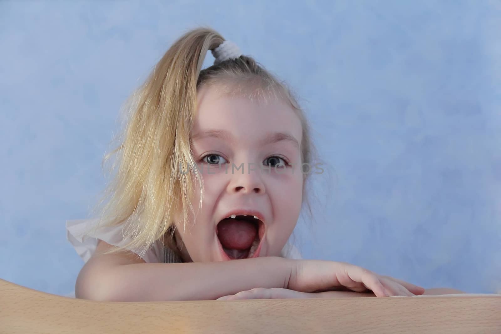 Portrait of girl with smile and open mouth
