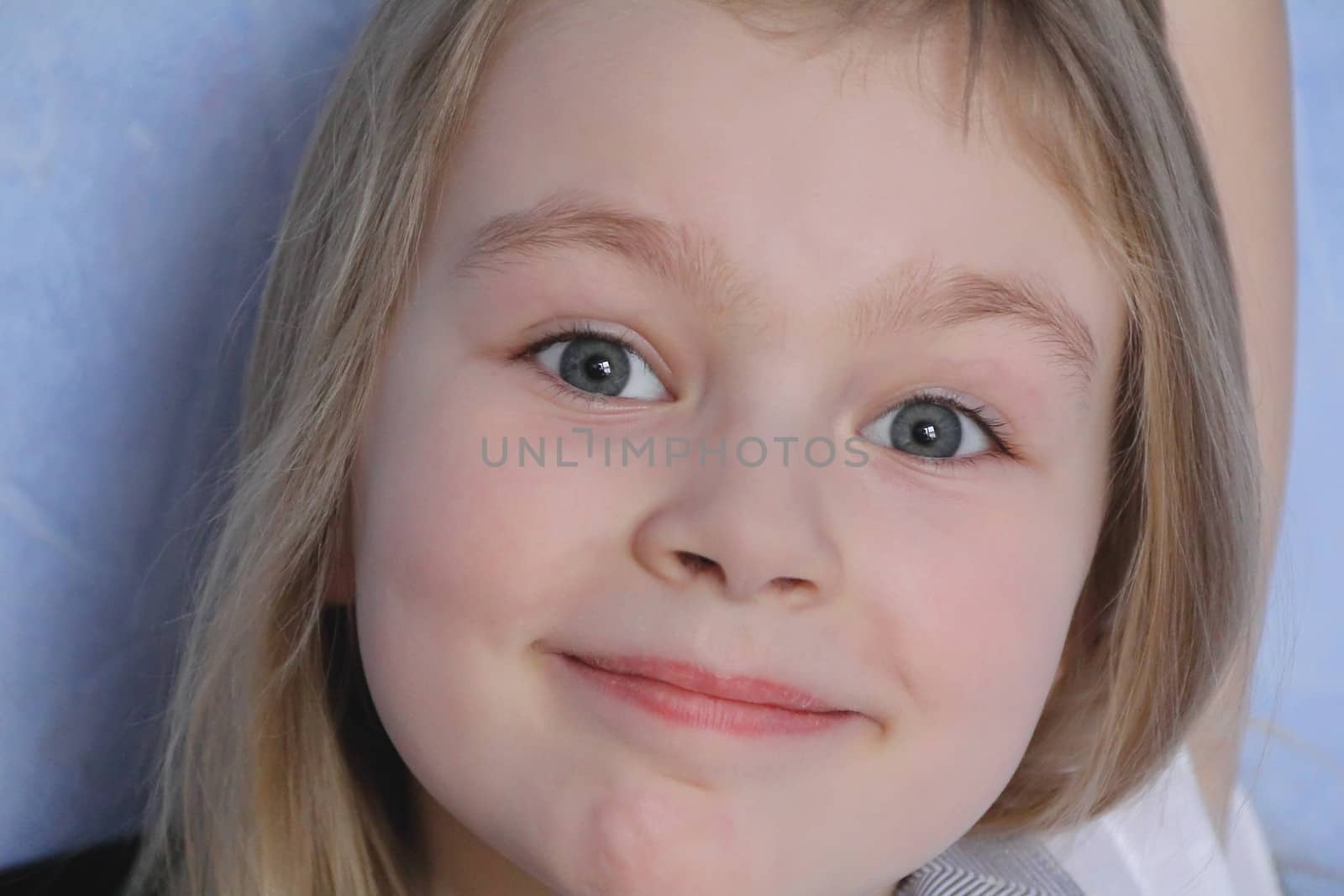 Portrait of beautiful girl with blue eyes