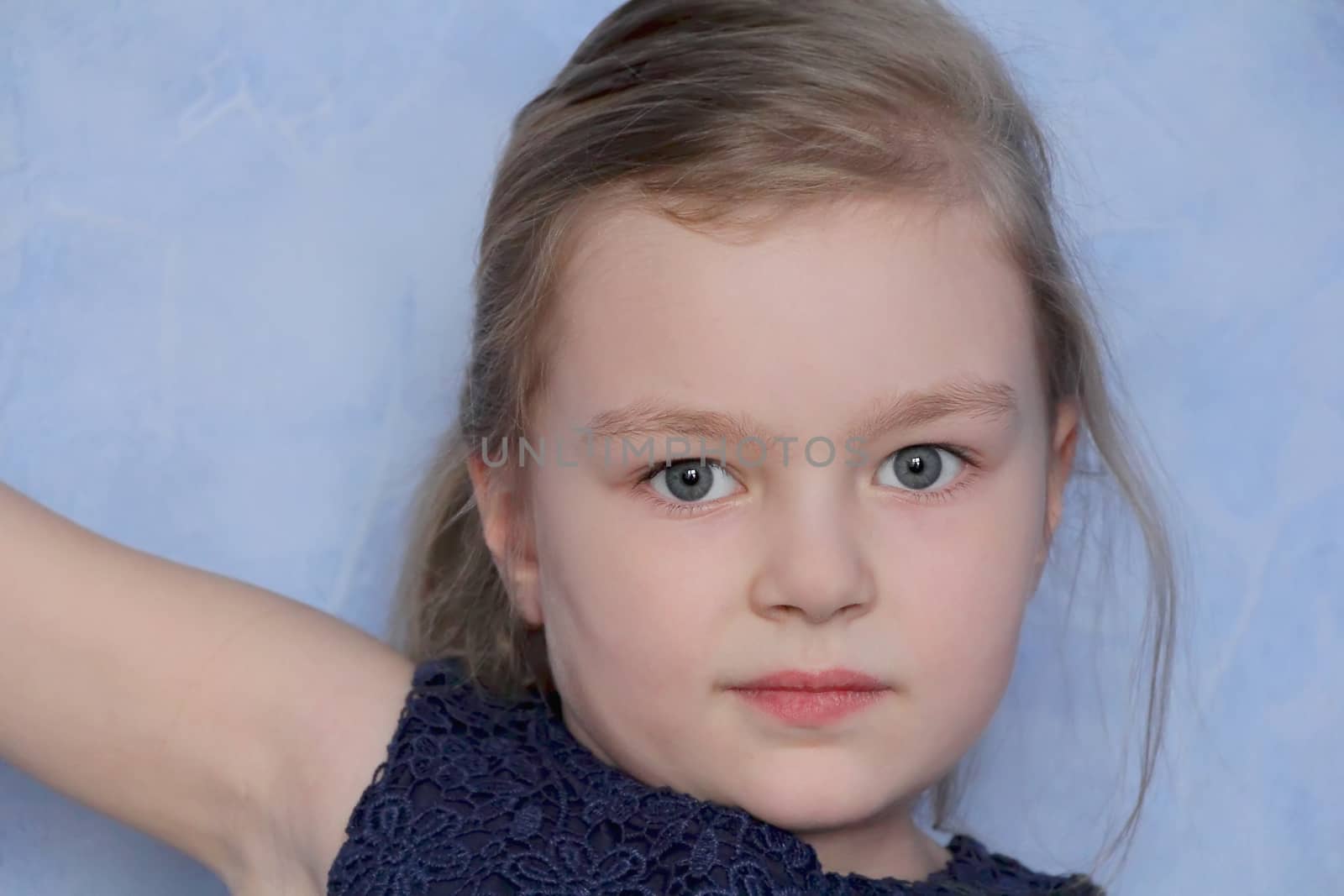 Portrait of beautiful girl with blue eyes