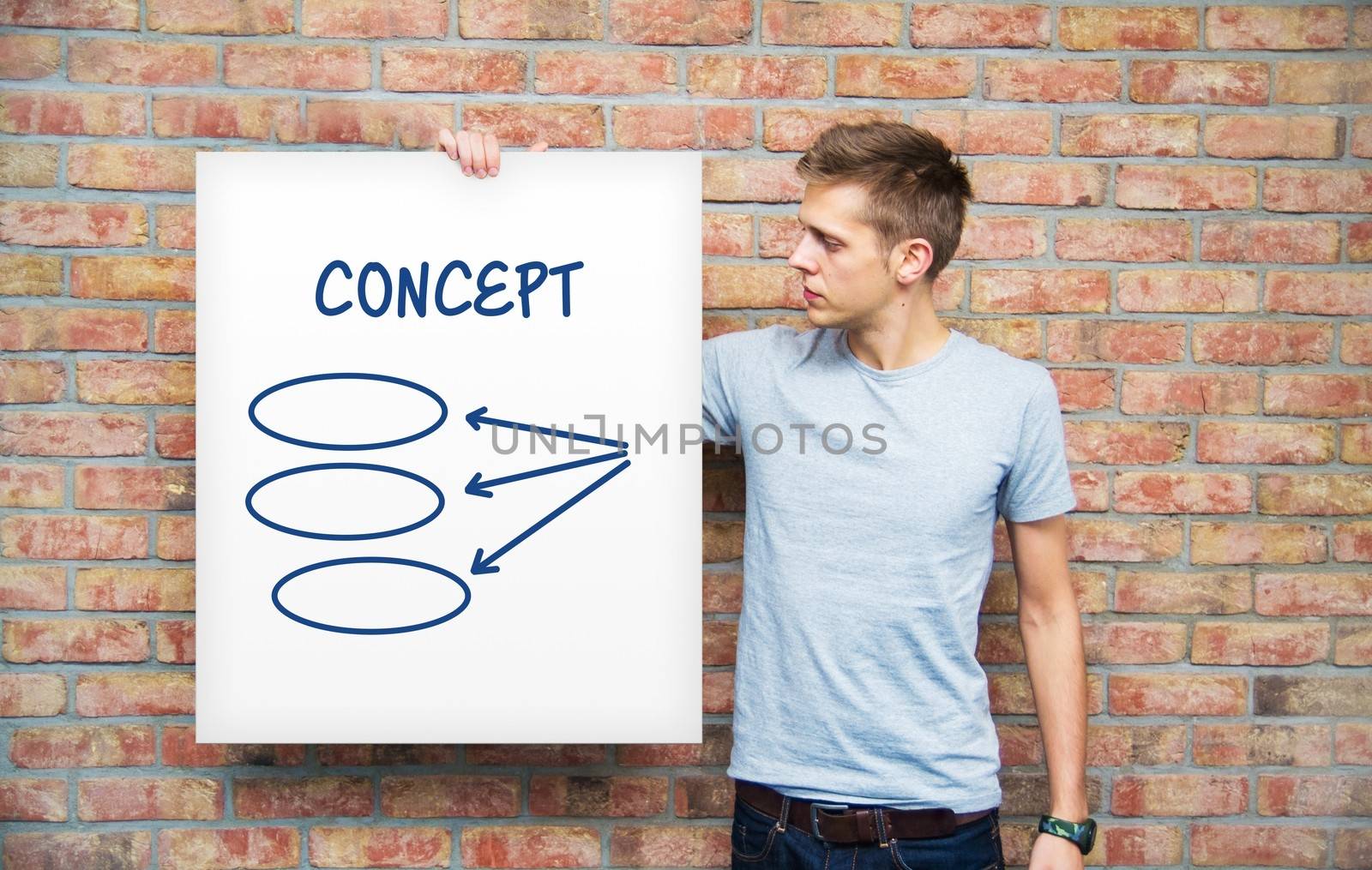 Young man holding whiteboard with diagram by simpson33