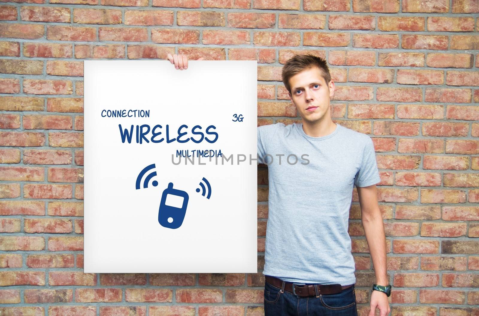 Young man holding whiteboard with multimedia content