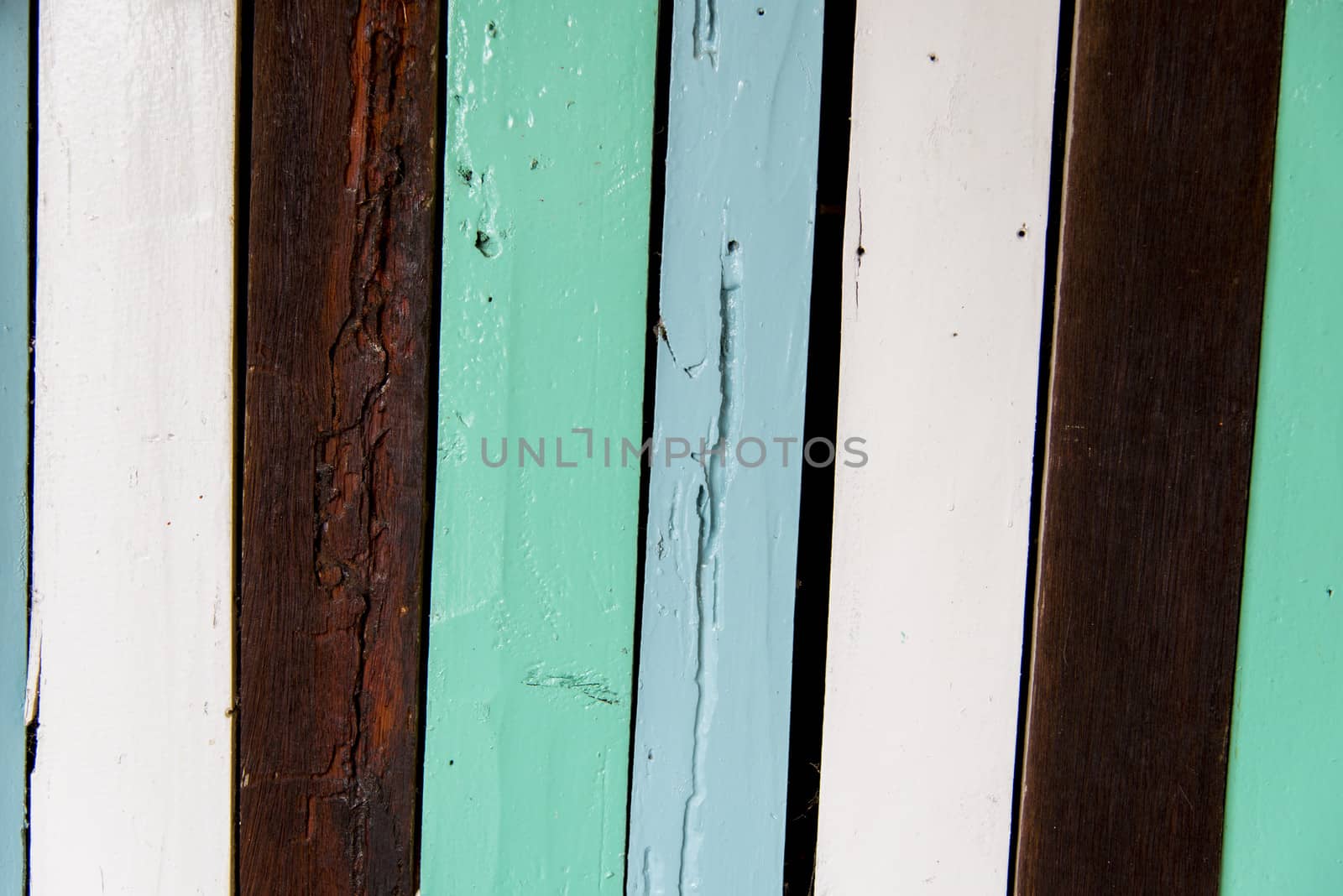 Colorful wooden wall on blue shade