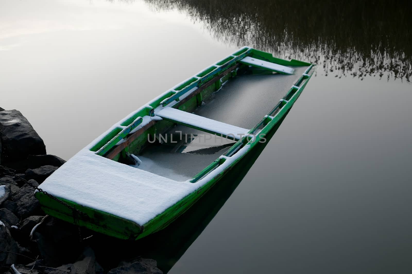 Old boat in winter snow